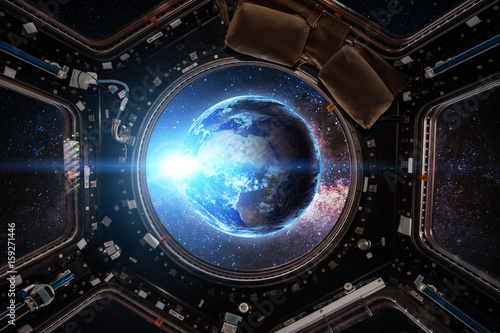 Fototapeta Naklejka Na Ścianę i Meble -  Earth and Spacecraft. Elements of this image furnished by NASA.