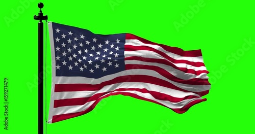 Close up USA flag blowing in the wind on green, looped slowmotion, 4K