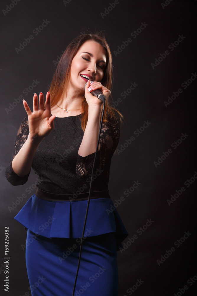Singer in dress with microphone