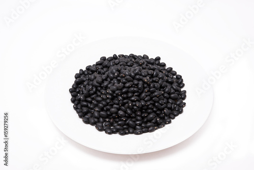 Seed Black bean in white plate on the white background