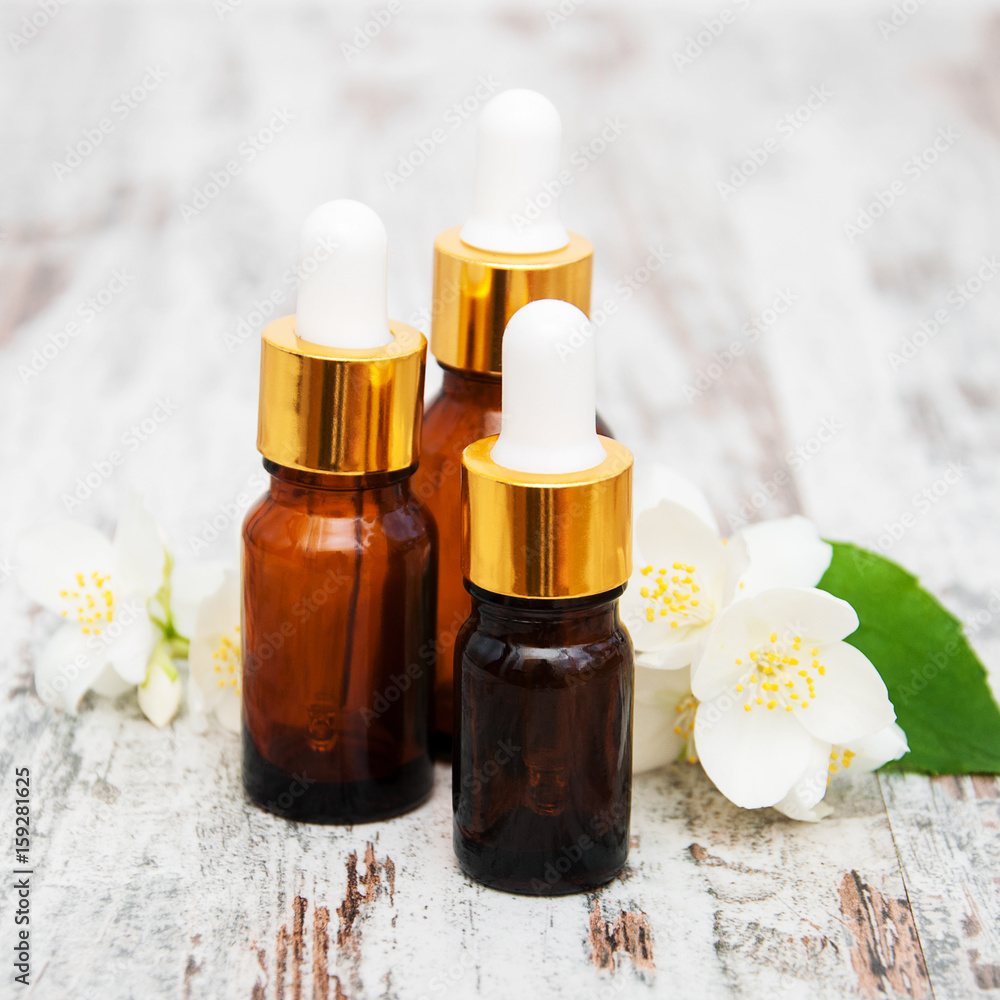 Massage oils and jasmine flowers Massage oils and jasmine flowers