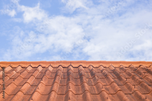 Roof tile on blue sky and white cloud background