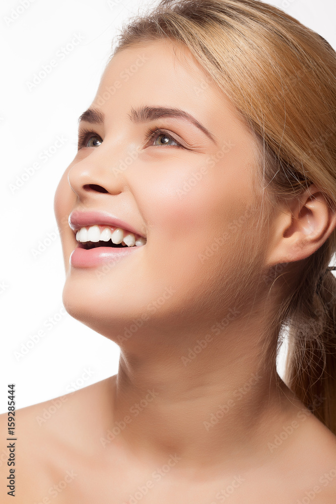 Gorgeous beautiful girl smiling on white background in studio photo. Perfect white teeth Gorgeous beautiful girl smiling on white background in studio photo. Perfect white teeth