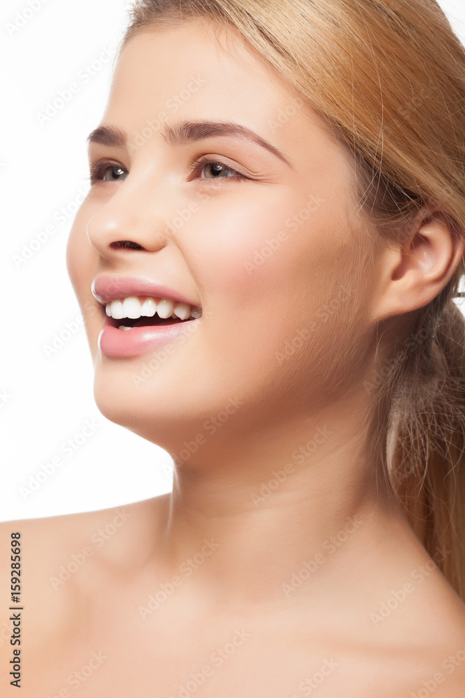 Gorgeous beautiful young woman smiling on white background in studio photo. Perfect white teeth Gorgeous beautiful young woman smiling on white background in studio photo. Perfect white teeth