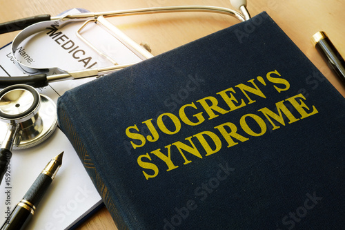 Book with title Sjogren's Syndrome on a table. photo