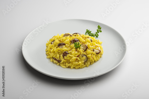 Plate of risotto with saffron and mushrooms