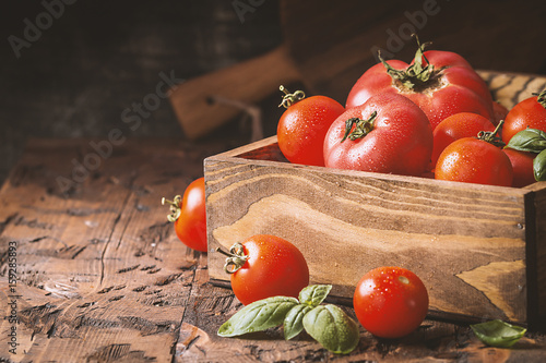 fresh tomatoes in a wooden crate photo