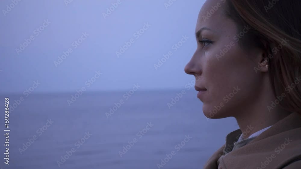 Beautiful woman near sea on a cold day Beautiful woman near sea on a cold day
