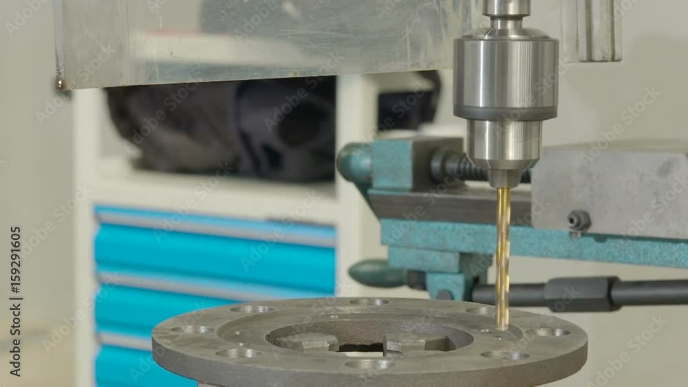 Metal drilling closeup in metal workshop on spare part. Metal drilling closeup in metal workshop on spare part.