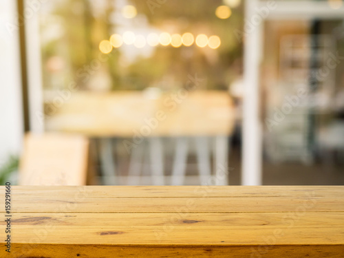 Wooden board empty table in front of blurred background. Perspective brown wood over blur in coffee shop or cafe- can be used for display or montage your products.Mock up your products.
