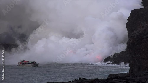 Hawaiian Boat Tour at the scenic point of Lava flowing into the ocean. Big Island, USA.