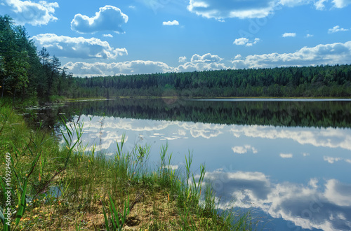Summer Landscape With Sky Reflection On A Water
