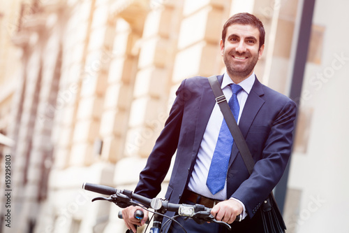 Young businessmen with a bike