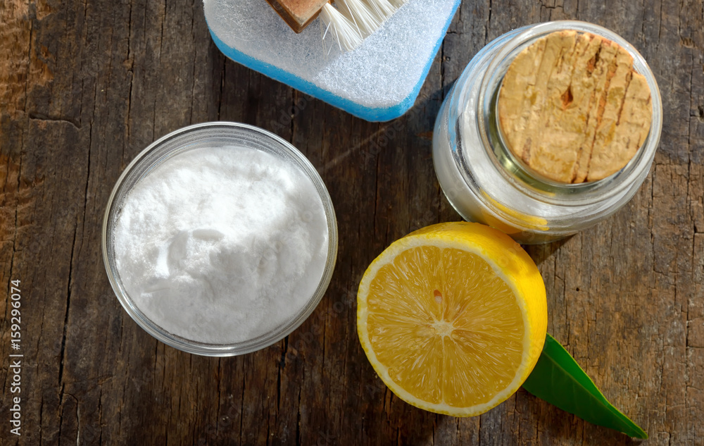 Tools with lemon and sodium bicarbonate on wood Tools with lemon and sodium bicarbonate on wood