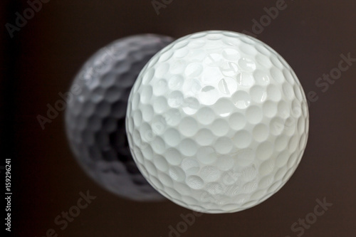 Top view the new white golf ball with the reflection, sport concept.