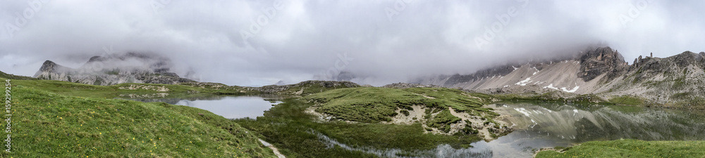 Panoramic view of lake and mountain on a cloudy day, Italian Dolomites