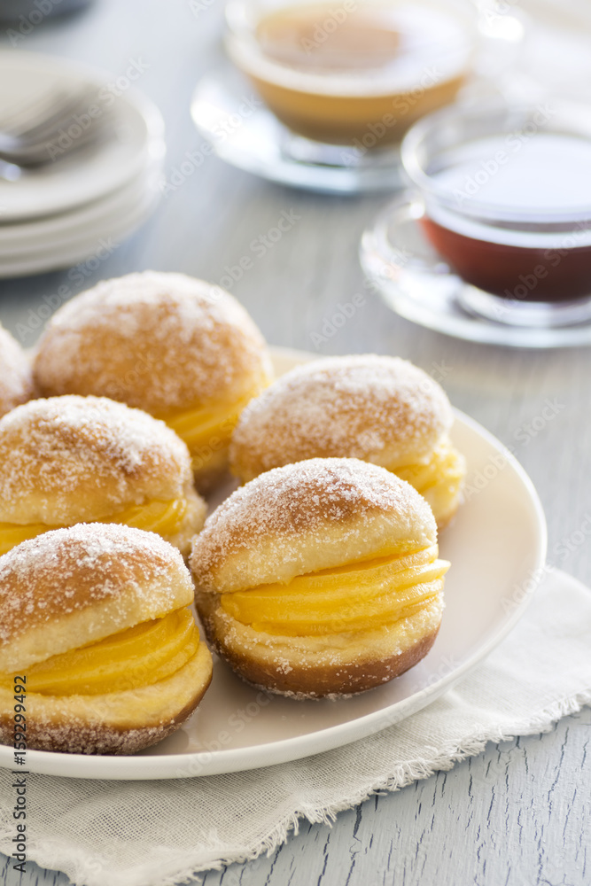 Bolas de Berlim, Portuguese Berliners, or Fried Donuts Filled with Sweet Egg Paste Bolas de Berlim, Portuguese Berliners, or Fried Donuts Filled with Sweet Egg Paste