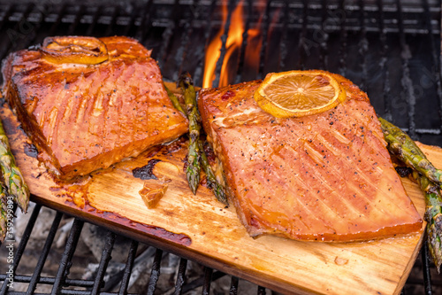 cedar plank salmon with lemon on a grill