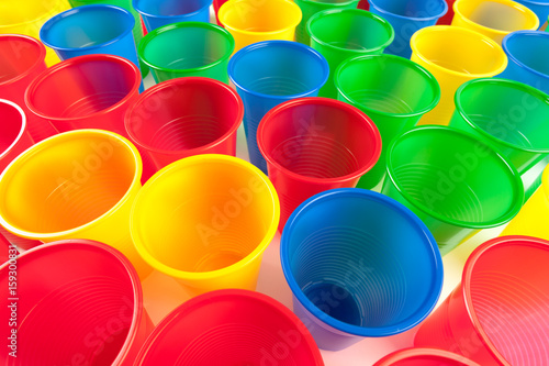 Multicolor plastic glasses isolated on white background