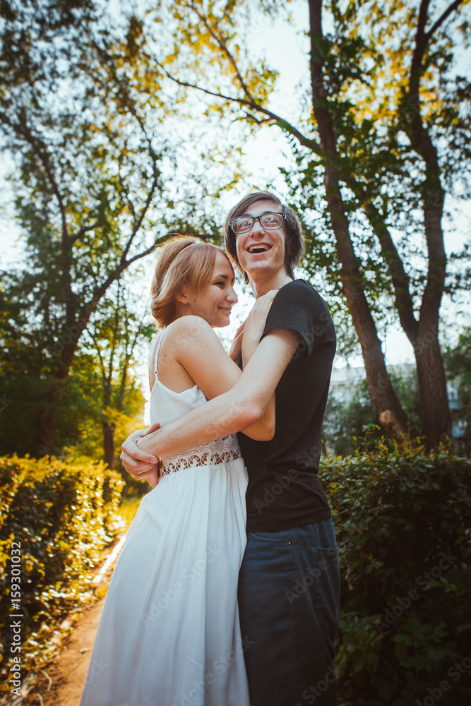 guy and the girl embracing on a background of park guy and the girl embracing on a background of park