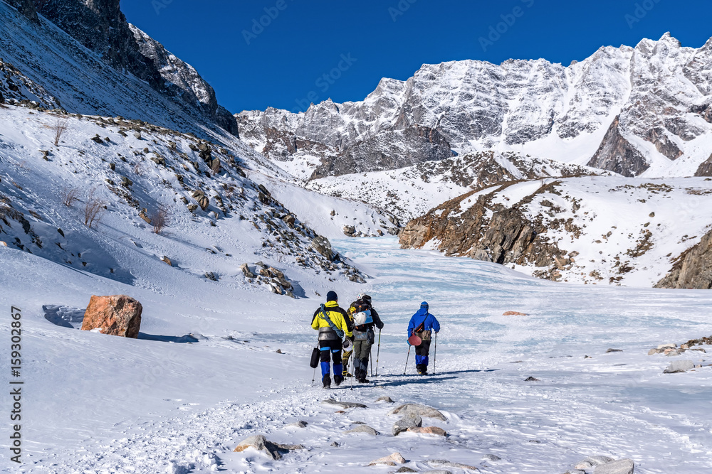 A group of tourists goes to climb Munku-Sardyk mount
