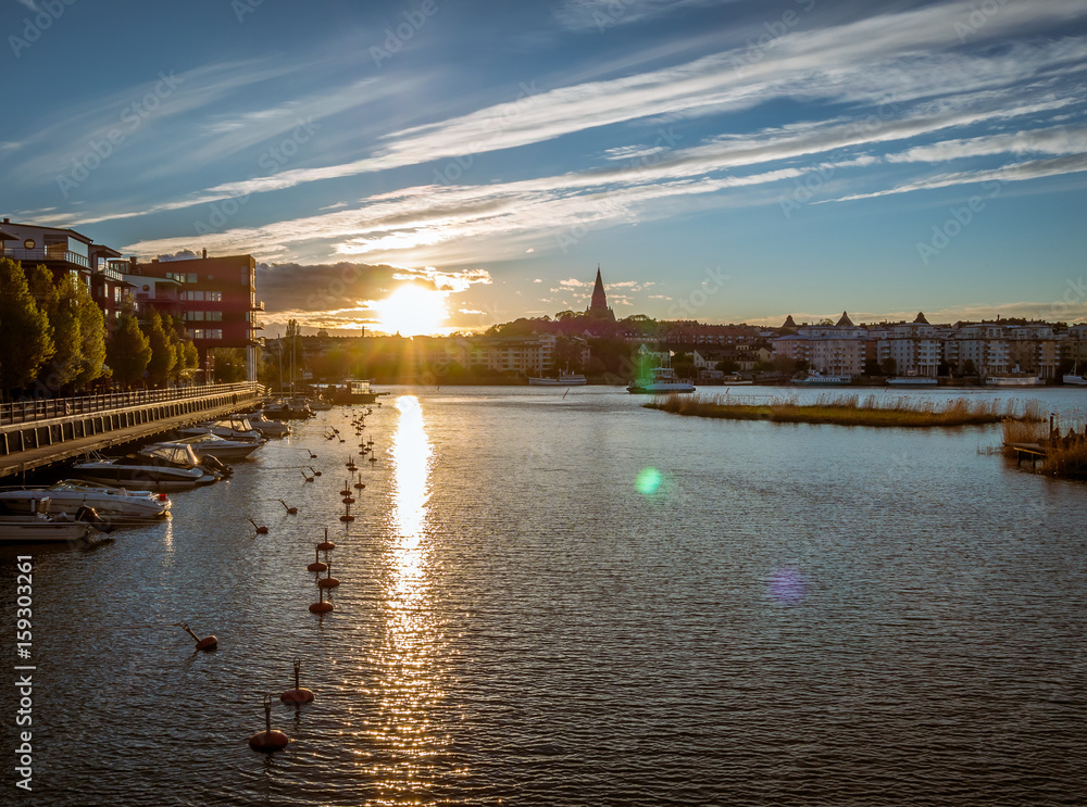 Obraz premium Sunset view of lake in Hammarby Sjöstad and Södermalm in Stockholm, Sweden