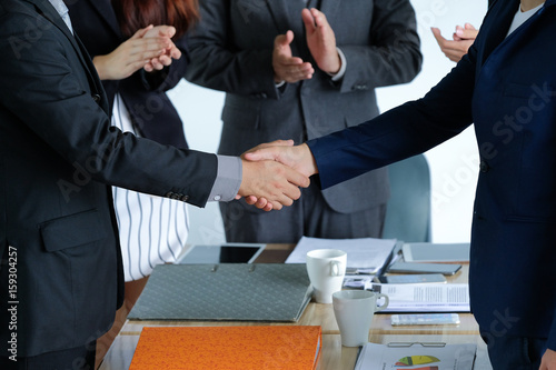 Portrait Of Multiracial Businesspeople Brainstorming In Meeting