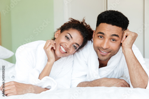 Happy young african loving couple on bed © Drobot Dean