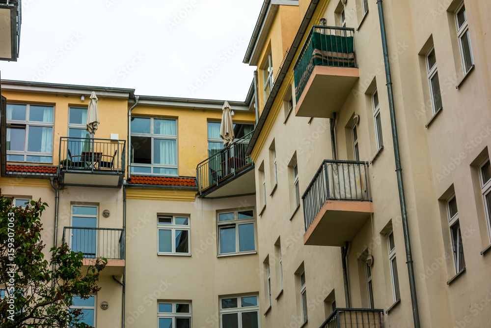 Fototapeta premium orange apartment houses at Friedrichshain with balconies