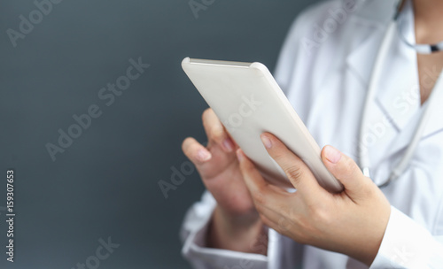 female doctor using cell phone