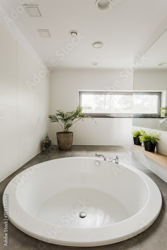 Modern bathroom with round bathtub