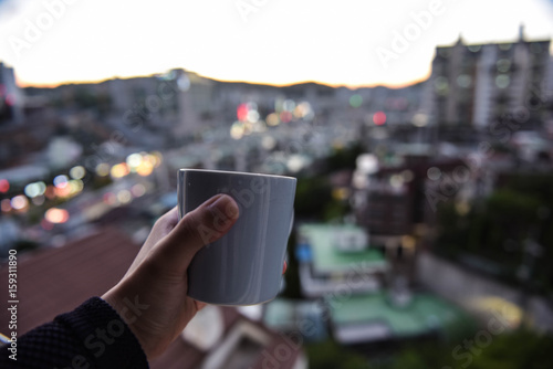 Photography cup with hand, city scape in seoul korea