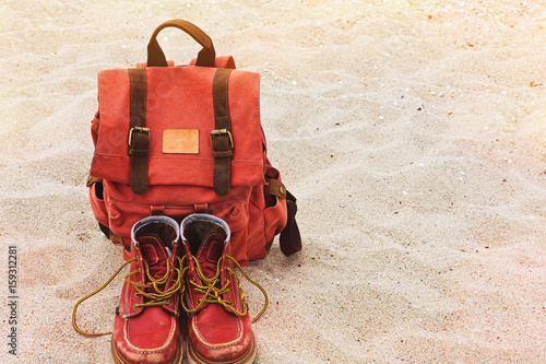 Wallpaper Mural Vintage backpack and worn boots on the sand beach Torontodigital.ca