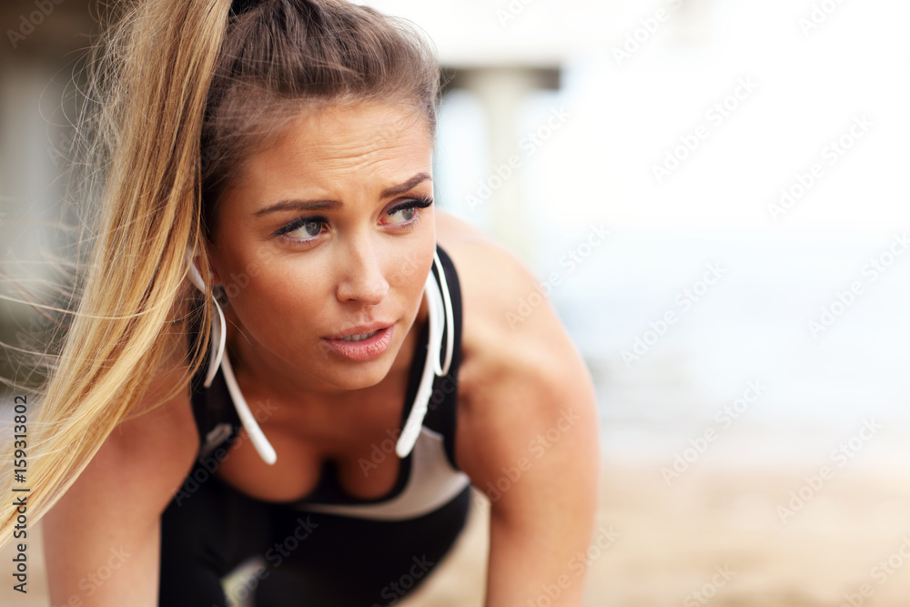 Naklejka premium Woman jogging on the beach