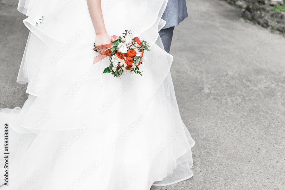 The bride is holding a wedding bouquet The bride is holding a wedding bouquet
