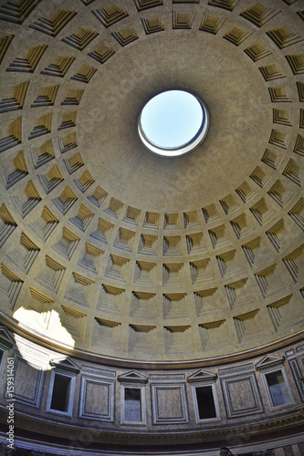 The landmark Pantheon in Rome, Italy. Originally a temple, and now a church, it has a coffered concrete dome which has a central opening or oculus to the sky. 