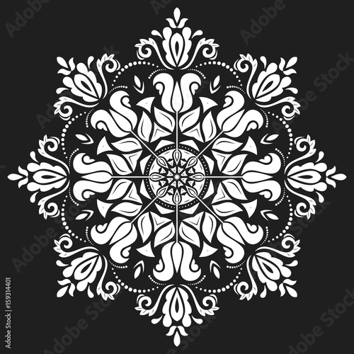 Fototapeta Naklejka Na Ścianę i Meble -  Oriental round white pattern with arabesques and floral elements. Traditional classic ornament. Vintage pattern with arabesques