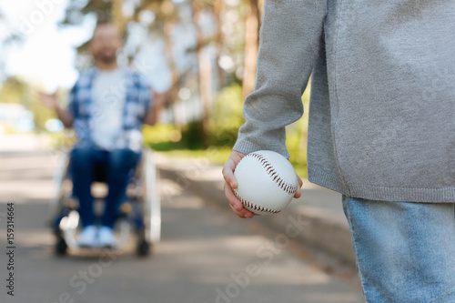 Close up of female hand than holding ball for baseball