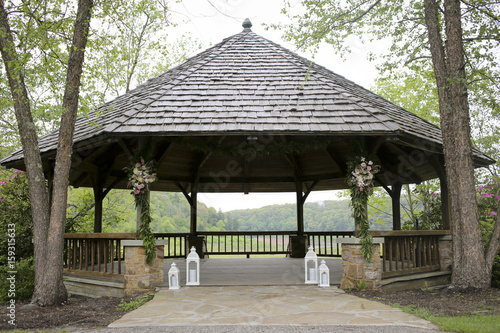 Wooden Gazebo Decorated for a Rustic Wedding Ceremony © holly