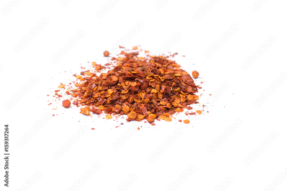 powder and dried chili peppers isolated on white background