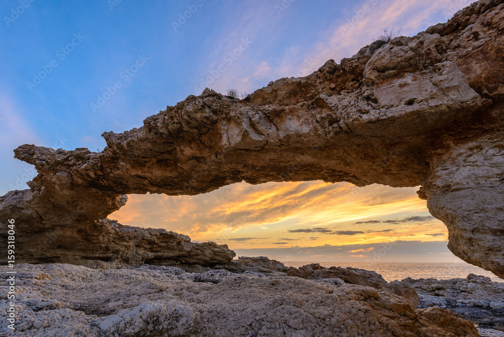 Natural arch of Portinatx at sunset, Ibiza, Spain