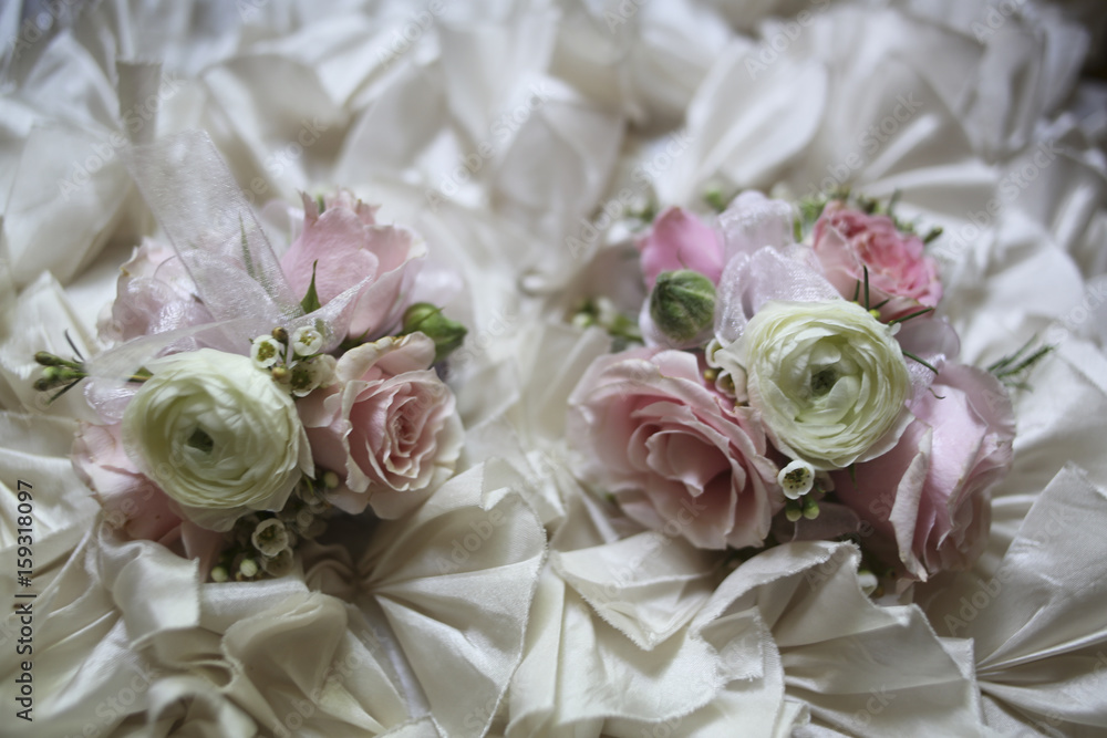 Obraz premium Pink and White Wedding Corsages on a Ruffled Fabric