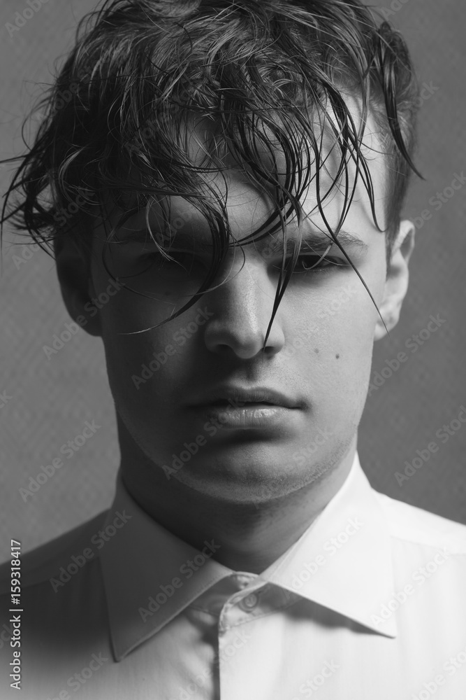 Male beauty concept. Portrait of young man with perfect haircut wearing  white classic shirt. Old Hollywood star style. Wet curly hair. Close up.  Monochrome studio shot Stock Photo | Adobe Stock