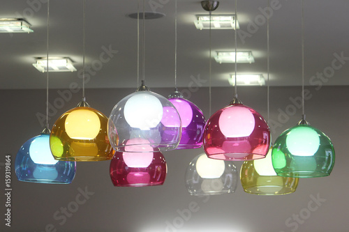 Lamps with colorful glass shades decorate the room. Vivid detail in the interior.