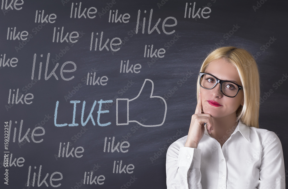 Business Woman and like symbol on the blackboard Business Woman and like symbol on the blackboard