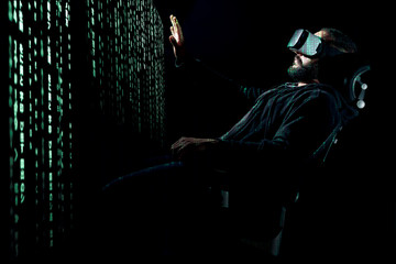 Young hipster bearded man wearing virtual reality glasses. Virtual data concept.