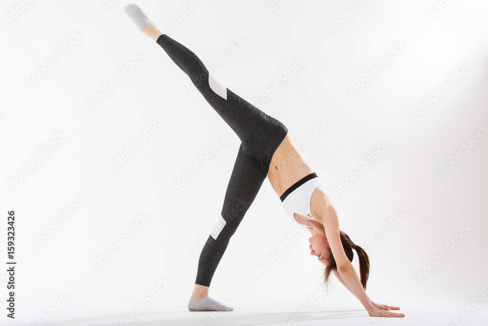 Young woman exercise yoga supported headstand Young woman exercise yoga supported headstand