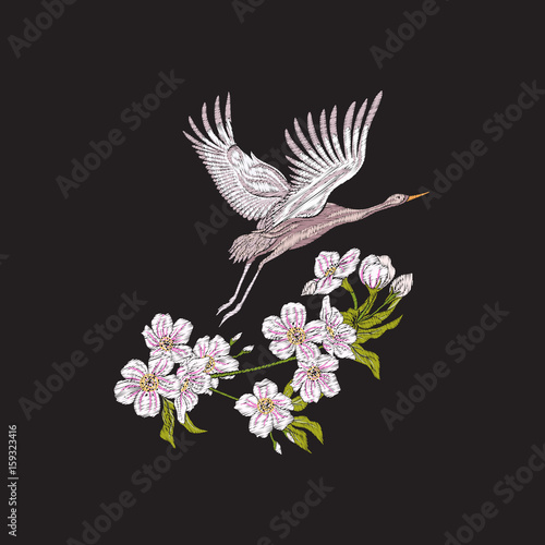 Embroidery flowers and crane on black background. Stock line vector illustration.