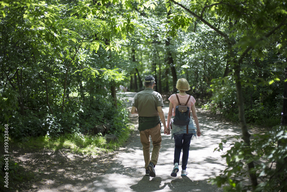 couple walking in park couple walking in park
