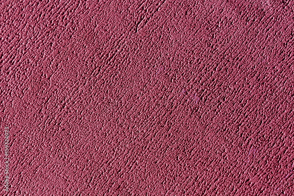 Fototapeta premium Pink color plaster wall surface.